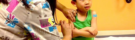 A toddle receives his five-year vaccination shots